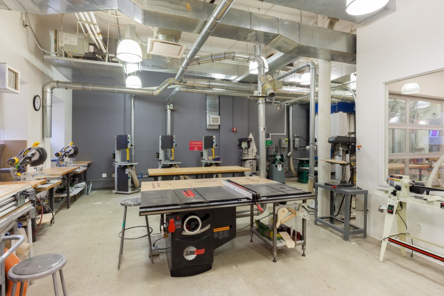 The BFA Fine Arts woodshop with panel, bend and table sawing machines and working tables.