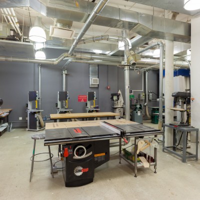 SawStop table saw, saw miter saws and multiple Band Saw in the woodshop.